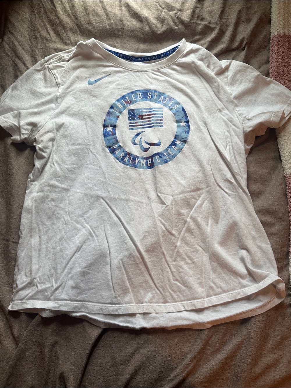 Nike White Tee with Blue USA Paralympic Emblem